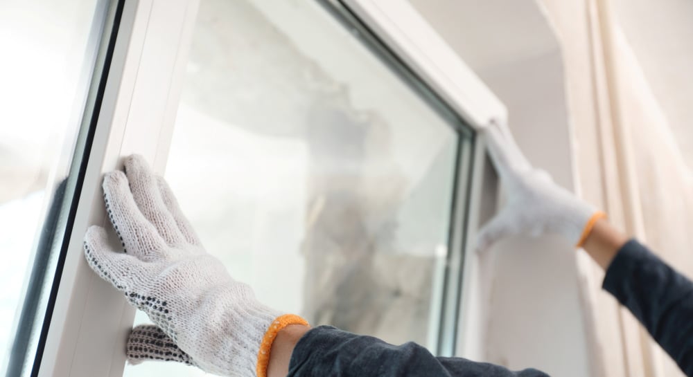 Man securing window